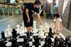 Commuters-interacting-with-the-chess-set-at-Bras-Basah-MRT-station (Photo SMRT)jpg