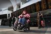 Avanti West Coast passenger with wheelchair uses the operator's Travel Companion service