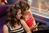 TGV passengers with mobile telephone (Photo: DB AG/Gustavo Alabiso).