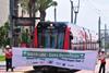 San Diego Trolley car breaks a banner.