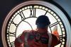 Close up of Dan Noble from Smiths of Derby cleaning exterior of clock face (Photo Network Rail)