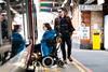 Wheelchair user boarding train