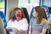 Two passengers wearing coronavirus face coverings on a Thameslink train (Photo: Go- Ahead)