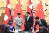 Chinese Premier Li Keqiang and Nepal's Prime Minister KP Sharma Oli witness the signing of the co-operation accords in Beijing on June 21. (Photo: Xinhua/REX/Shutterstock)