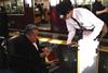 A member of Hankyu staff assisting a man who is a wheelchair user