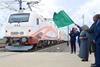 President of the United Republic of Tanzania, Hon. Dr. Samia Suluhu Hassan waving a flag to mark the official launch of freight transport using the SGR electric train transport from Dar es Salaam to Dodoma