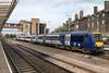 This image shows a train standing at Harrogate station