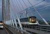 REM automated metro train travels over the Samuel De Champlain Bridge
