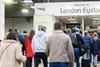 Passengers at London Euston station walking up the ramp from platforms to the concourse (Photo Network Rail)