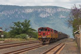 za-Transnet freight train at border with Swaziland-Eswatini-2019-credit Moehring-Shutterstock.jpg