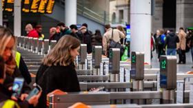 Customers walking through a gateline at Manchester Victoria station (Photo Northern)