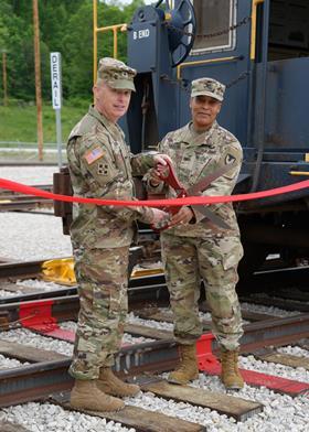 Brig Gen Daniel Duncan, Joint Munitions Command's commander, and Col Franyate Taylor, commander of Crane Army Ammunition Activity, cut a ceremonial ribbon on May 19 (Photo Randy Tisor, Crane Army Ammuniti