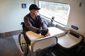 Wheelchair user on a train (Photo Back Up)