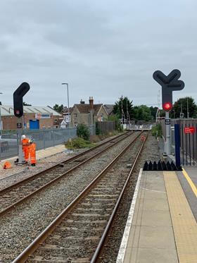 First section of East West Rail Phase Two railway commissioned - Standing Red Men pedestrian signals