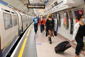 Passengers on London Underground's Piccadilly Line wearing coronavirus face coverings
