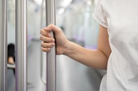 Person holding handrail