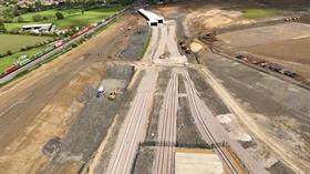 Drone shot of West Coast main line and soon to be built freight connection in Northampton