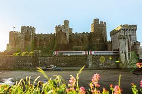 Transport for Wales train and Conwy castle