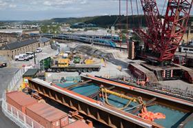 Huddersfield - TPE services cross John William Street Bridge - replacement deck in foreground