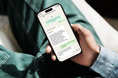 Passenger looking at mobile phone screen