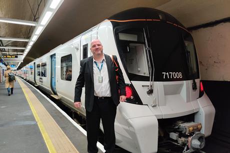 Driver Mark Webb in front of one of the first trains to run in passenger service digital in-cab signalling promising passengers a more reliable, greener service