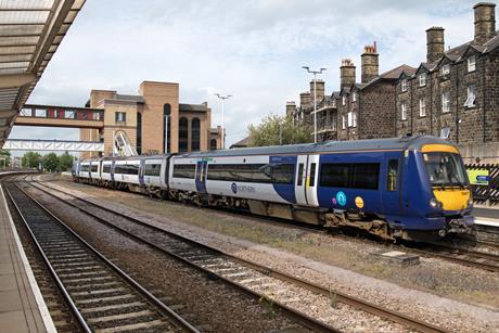 This image shows a train standing at Harrogate station
