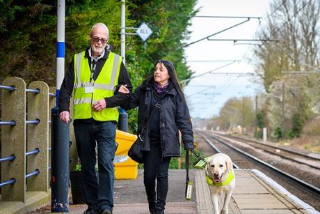 Blind passenger with guide dog and staff (Photo GTR)