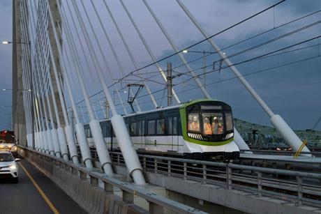 REM automated metro train travels over the Samuel De Champlain Bridge