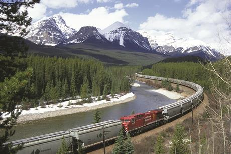 CP freight train and mountains in Canada