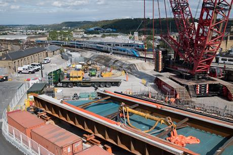 Huddersfield - TPE services cross John William Street Bridge - replacement deck in foreground