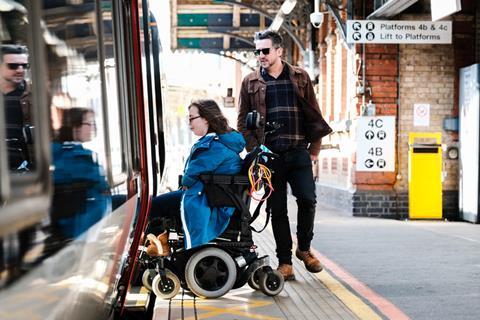 Wheelchair user boarding train