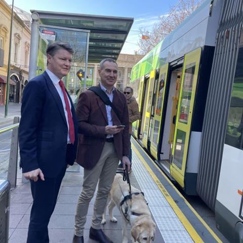 Melbourne tram passenger with guide dog