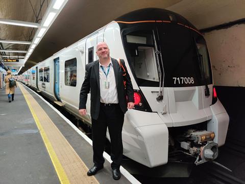 Driver Mark Webb in front of one of the first trains to run in passenger service digital in-cab signalling promising passengers a more reliable, greener service