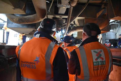 Industry colleagues looking underneath the train at the new technolgy (1)