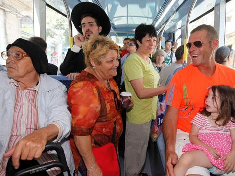 Passengers on a tram in Jerusalem.