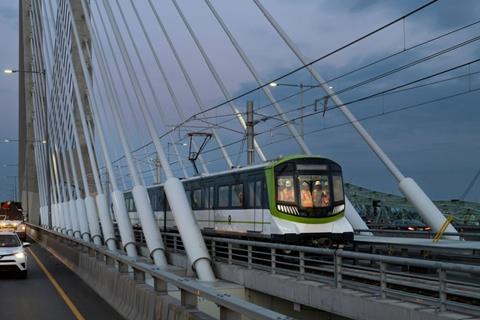 A REM automated electric train travels over the Samuel De Champlain Bridge.