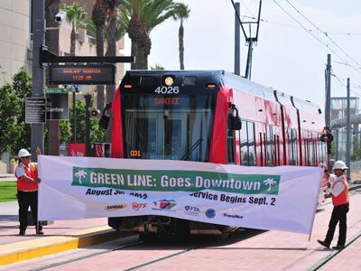 San Diego Trolley car breaks a banner.