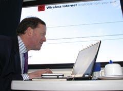 Man using wi-fi on a train.