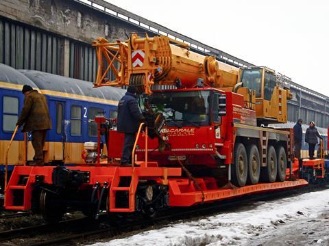 A railway wagon for carrying a road crane has been designed by DAXI and built by Electroputere VFU Pa?cani.