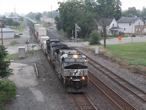 An eastbound NS doublestack train passes Goshen, Indiana, where a third track has been built to increase capacity and operational flexibility (Photo: Bob Johnston).