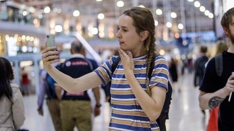 Deaf passenger using BSL interpretation app