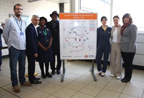Mayor of London and others stand next to the new London Overground map (Image Mayor of London)