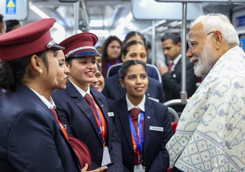 Modi and staff on RRTS (Photo PIB)