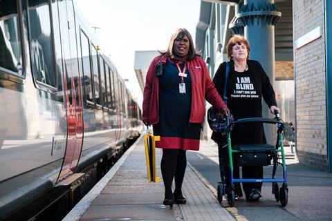 Blind passenger being assisted at a station