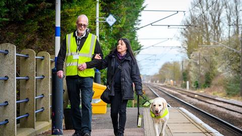 Blind passenger with guide dog and staff (Photo GTR)