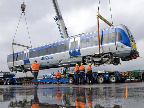 CAF Class 4000 diesel multiple-unit for Northern Ireland Railways is unloaded at Belfast docks on 14 March 2011.