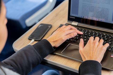 Passenger working on a TransPennine Express train