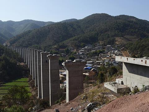 China is seeking to develop rail links between the southern province of Yunnan and neighbouring countries, including Myanmar (left), Laos and Vietnam. It hopes to create through corridors to Thailand and Singapore.