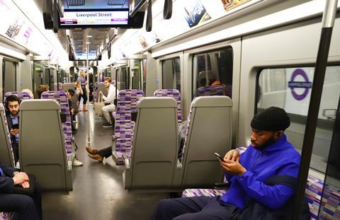 TfL Image - Customers using mobiles on Elizabeth line trains