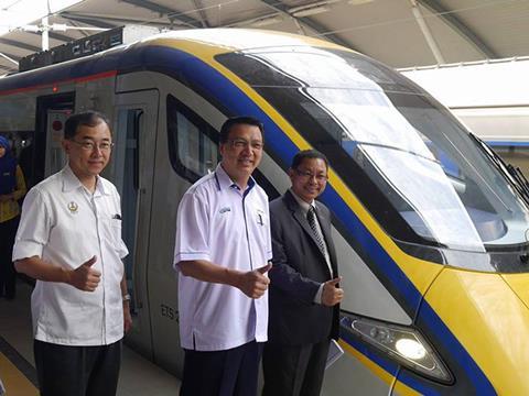 The Electric Train Service was inaugurated by Minister of Transport Liow Tiong Lai (centre).